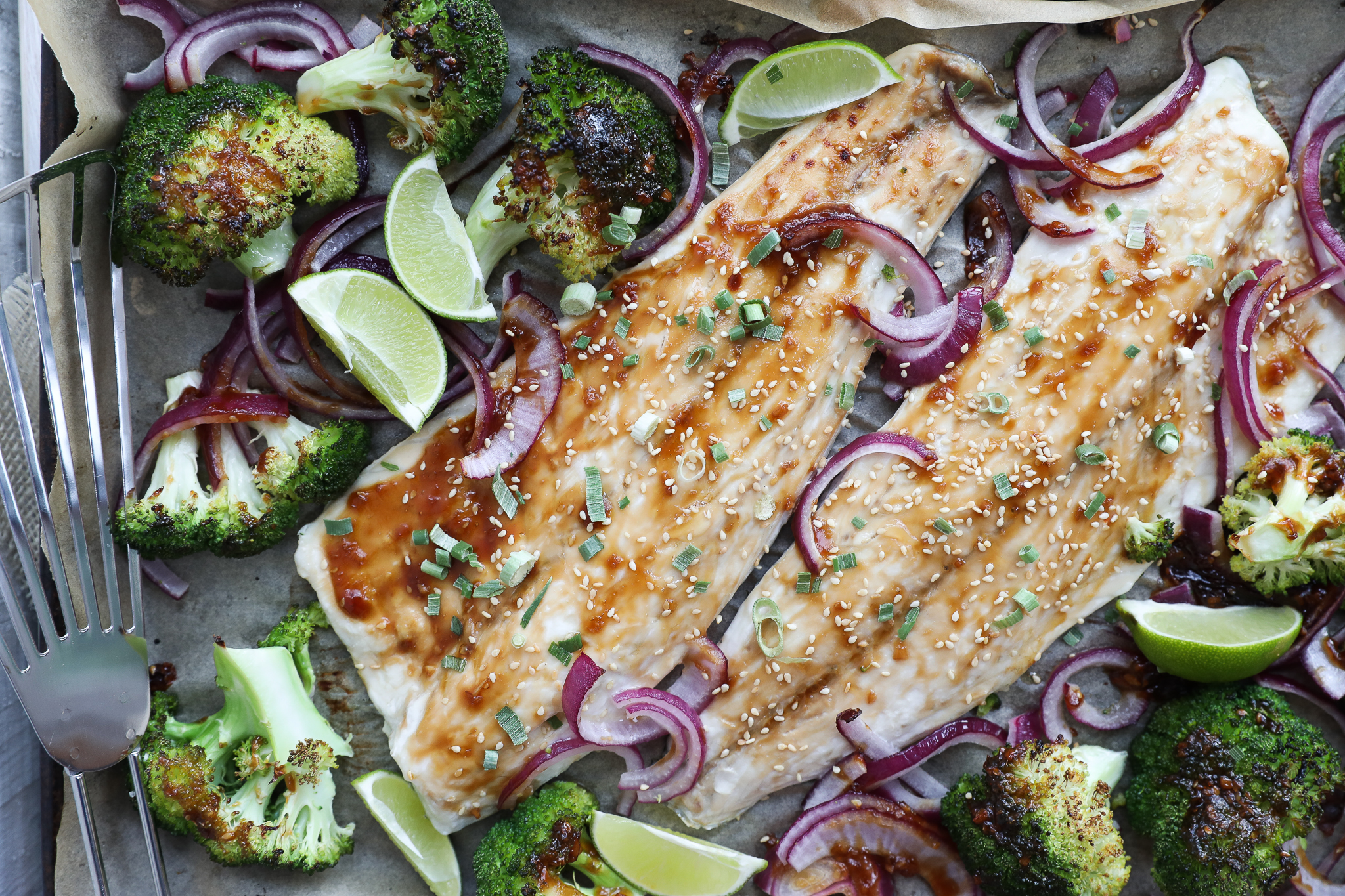 Sheet Pan Teriyaki Baked Striped Bass with Broccoli | My Cape Cod Kitchen An overhead image of baked fish