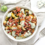 Roasted Brussels sprouts with blue cheese and bacon in a bowl