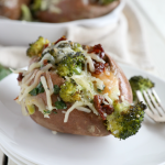 Cheddar and Broccoli Stuffed Sweet Potatoes in a baking dish. The perfect side dish to serve alongside broiled or baked fish or chicken.