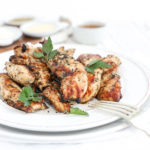 A straight on shot of a plate of grilled chicken