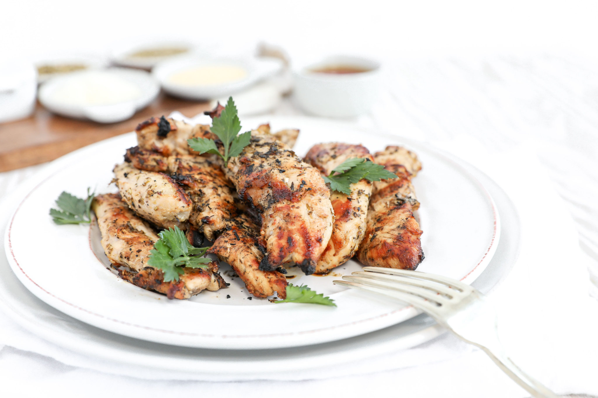 The Best Grilled Chicken A straight on shot of a plate of grilled chicken