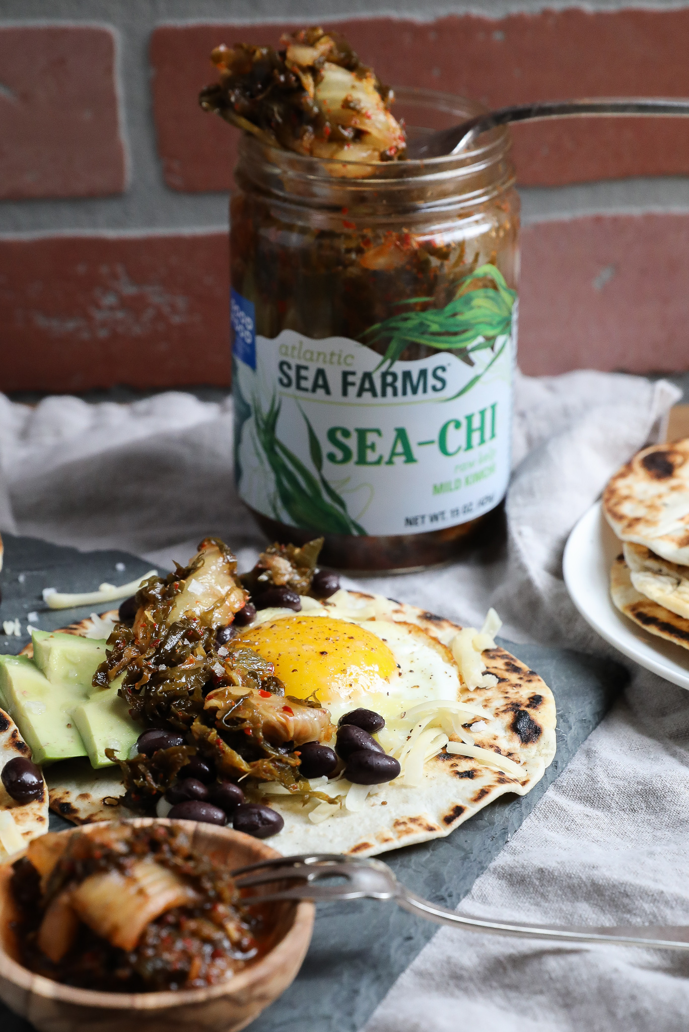 An image of breakfast tacos with Sea-Chi in the background.
